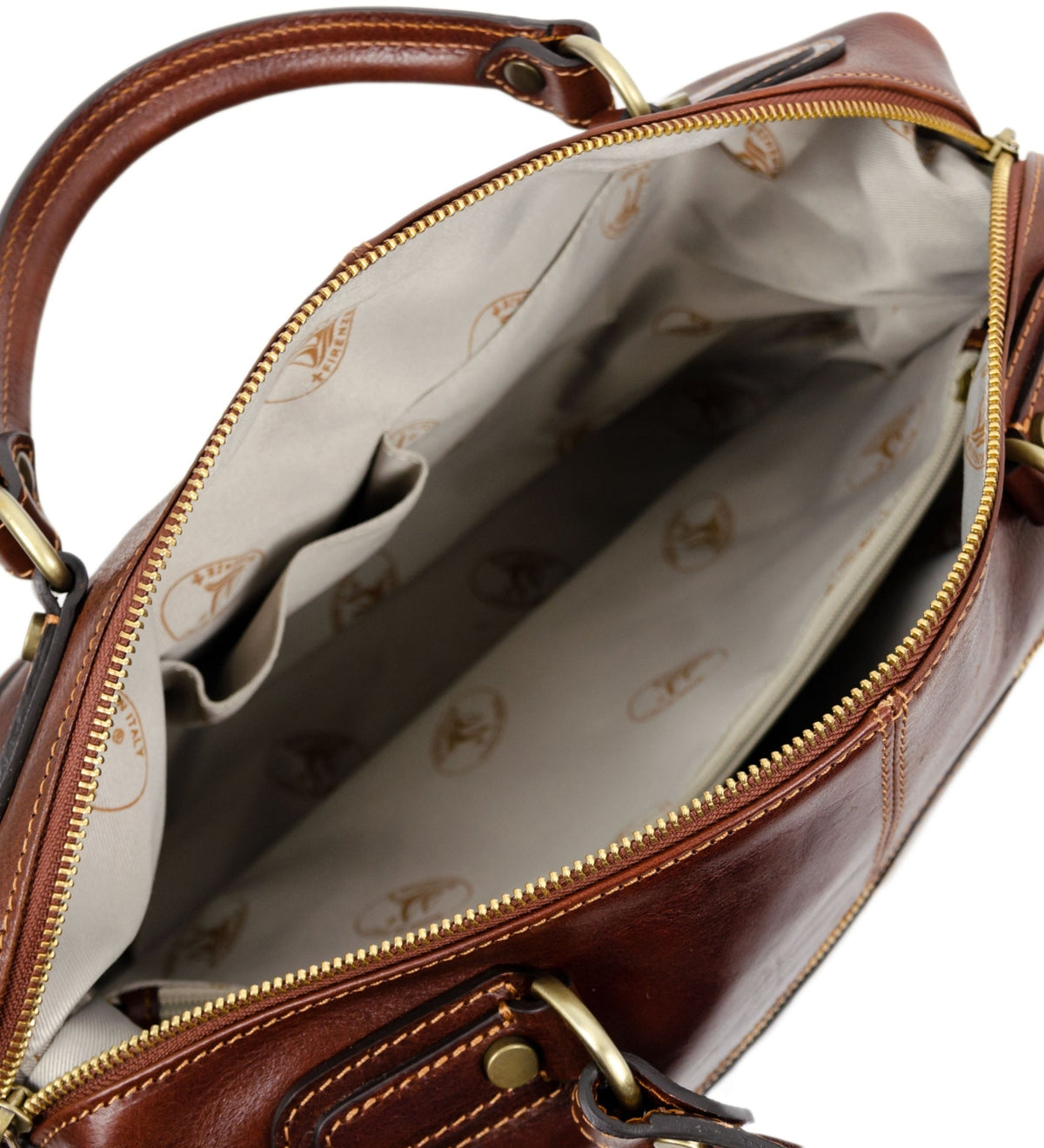 Brown East of Eden leather bag unzipped at the top, logo printed cotton lining inside